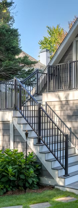 Modern composite deck stairs and railing